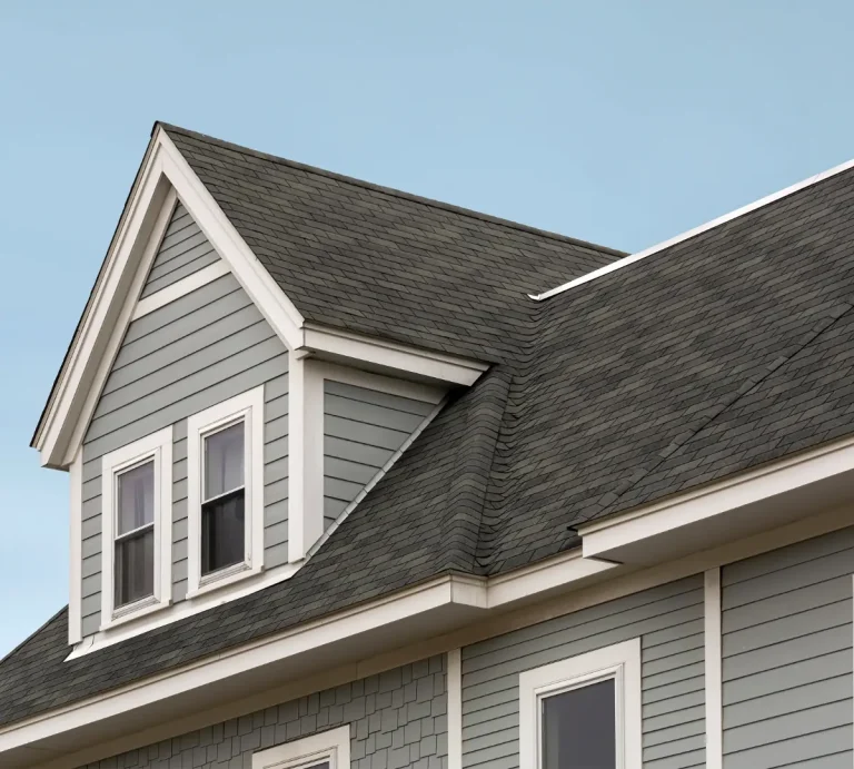 A home with grey siding and a new roof.